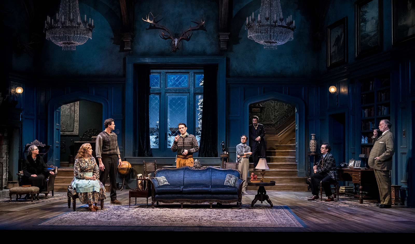 Cast members performing on the stage production of The Mousetrap.