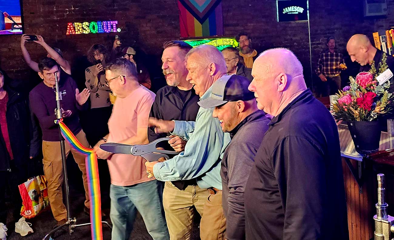 Rainbow ribbon cutting ceremony for the re-opening of the 19 Bar.