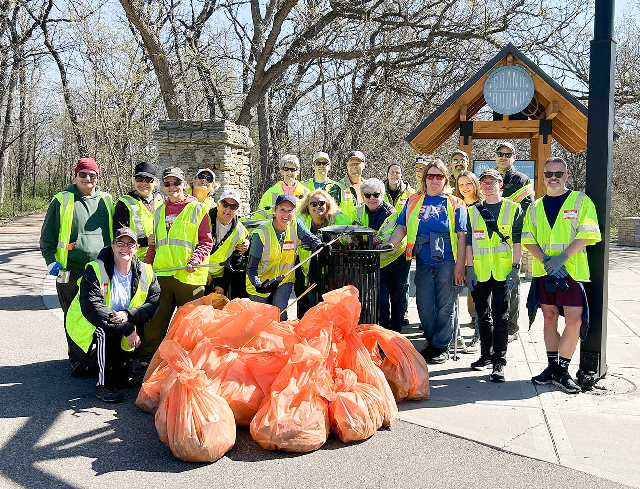 Gay for Good volunteers picking up trash in the community.
