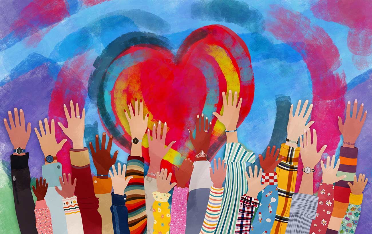 Group of diverse people with arms and hands raised towards a hand painted heart.